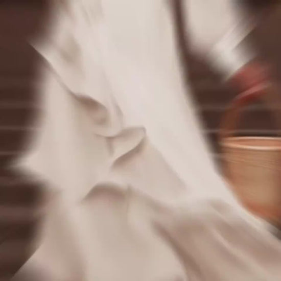 Timeless women's white dress featuring ruffles, long sleeves, and a flattering waist tie, ideal for weddings or proms.